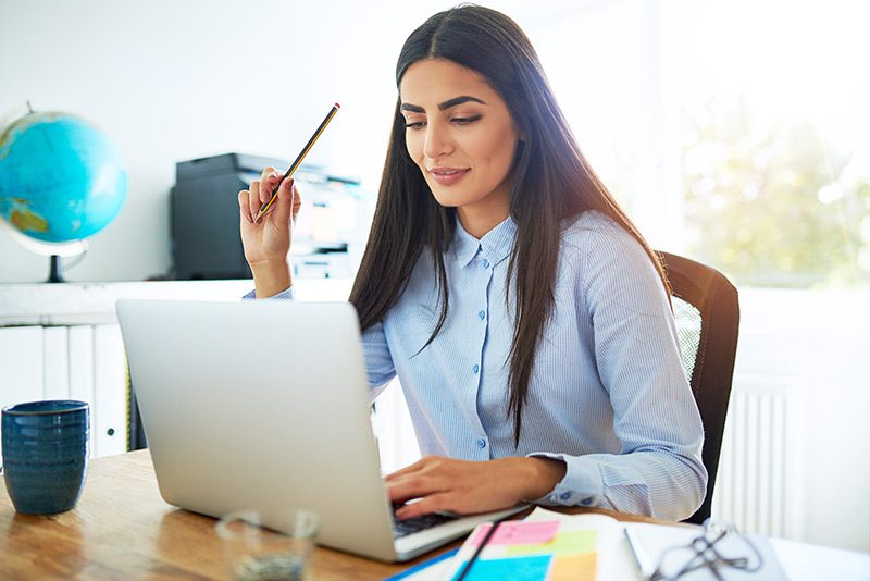 Woman Holding A Pencil
